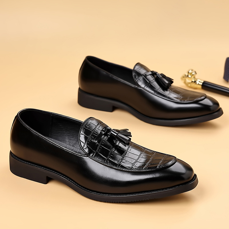 Textured brown leather men's tassel loafers. Comfortable slip-on dress shoes for sophisticated gentlemen.