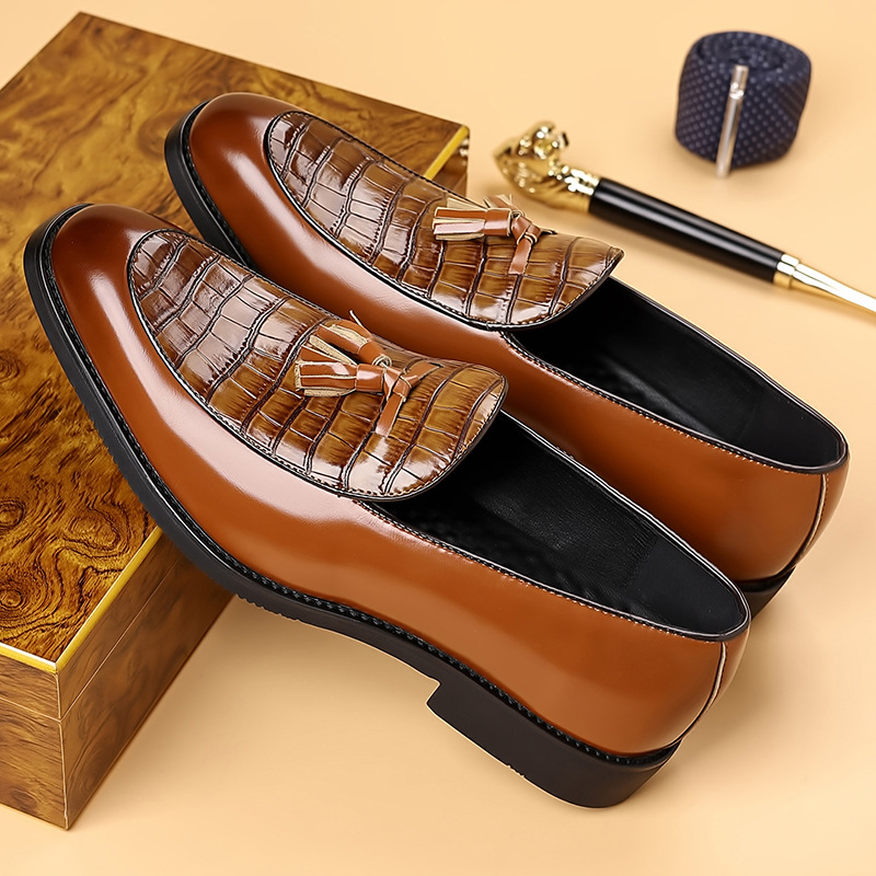 Gentlemen's black tassel loafers. Polished slip-on dress shoes perfect for formal or business casual attire.