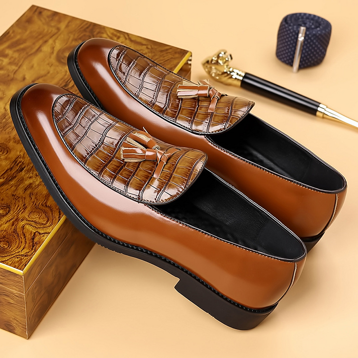Gentlemen's black tassel loafers. Polished slip-on dress shoes perfect for formal or business casual attire.