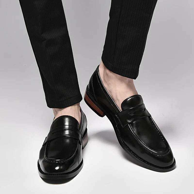 Timeless men's slip-on loafers, showcasing a beautiful polished finish, a must-have for dress & formal fashion.