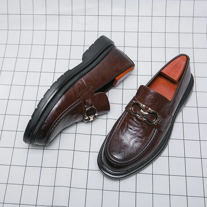 Elegant men's slip-on work shoes, polished for a sharp, professional appearance.