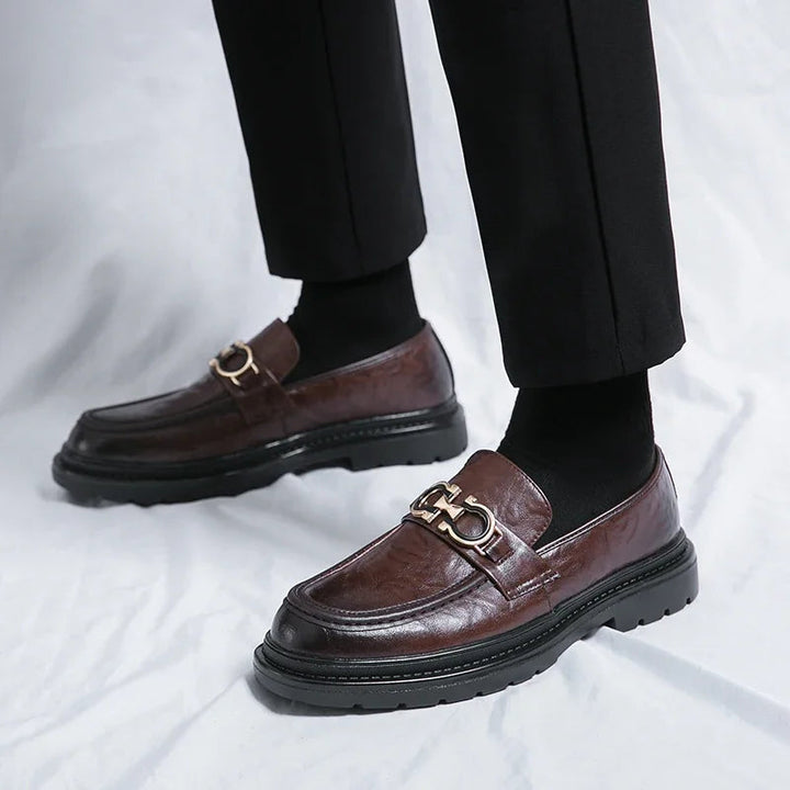 Men's polished black slip-on loafers, perfect for formal and smart casual outfits.