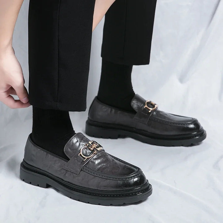 Men's elegant slip-on casual shoes, polished for a refined smart casual ensemble.