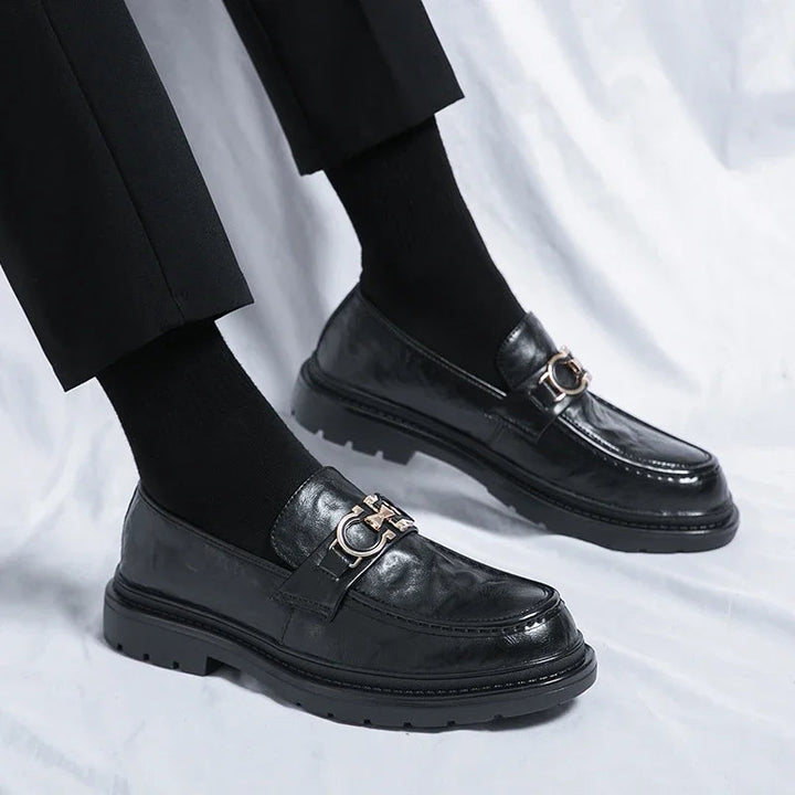 Polished black slip-on men's shoes, versatile for work & daily wear.