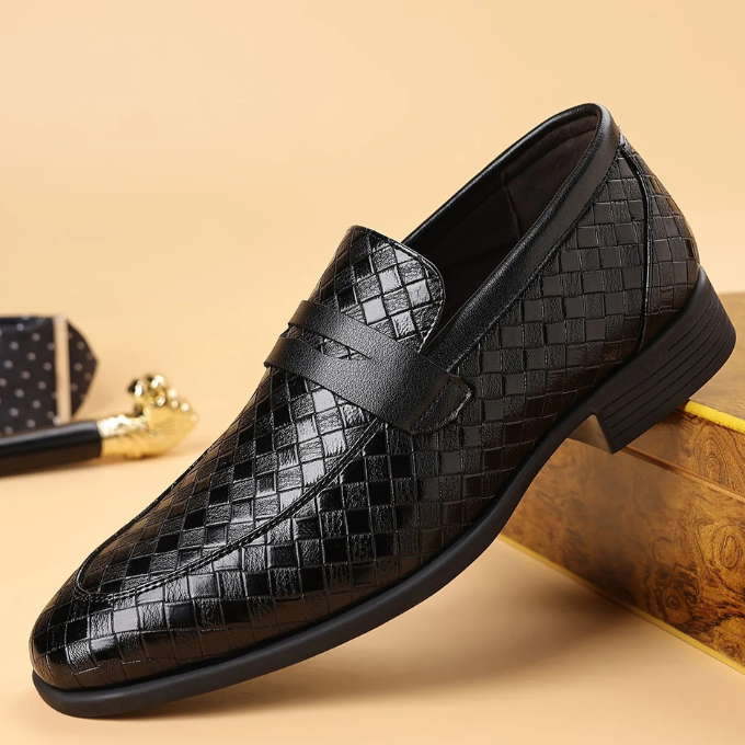 Dressy casual men's loafers, featuring a polished finish & woven slip-on design.