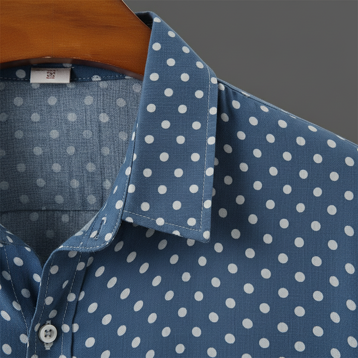 Button-up men's cabana shirt, short-sleeve & polka dot pattern. Ideal for summer casual wear.