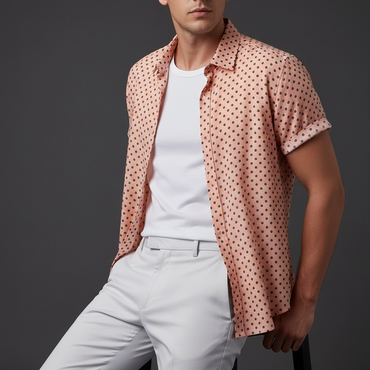 Polka dot men's short-sleeve cabana shirt. Casual button-up design, perfect for summer fashion.