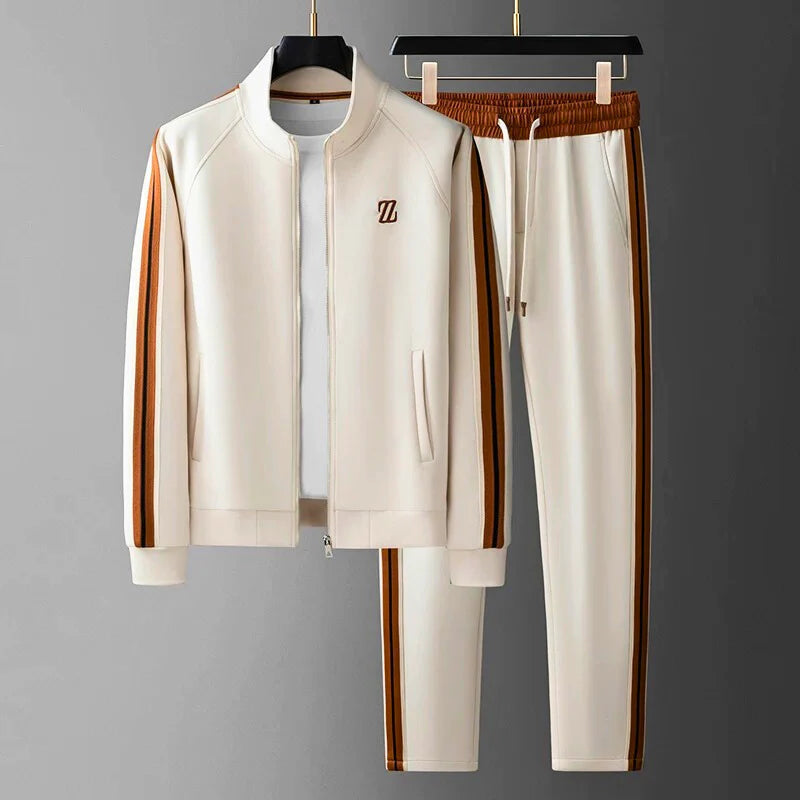 Stylish men's athleisure tracksuit, versatile casual outfit for sport or loungewear, featuring zip jacket & pants.