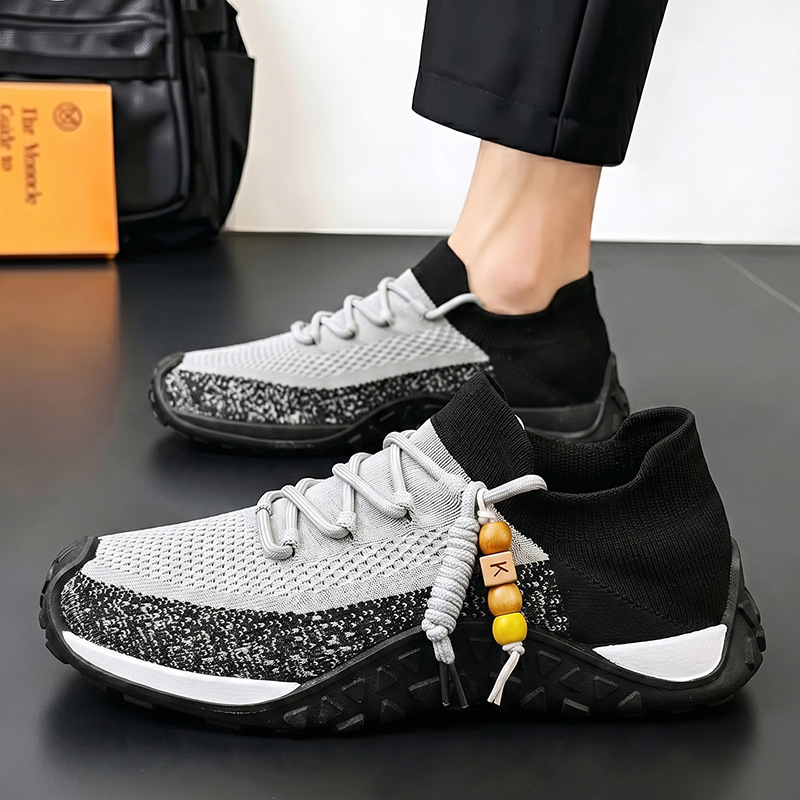 Side view of stylish gray men's walking shoes, lightweight and comfortable.