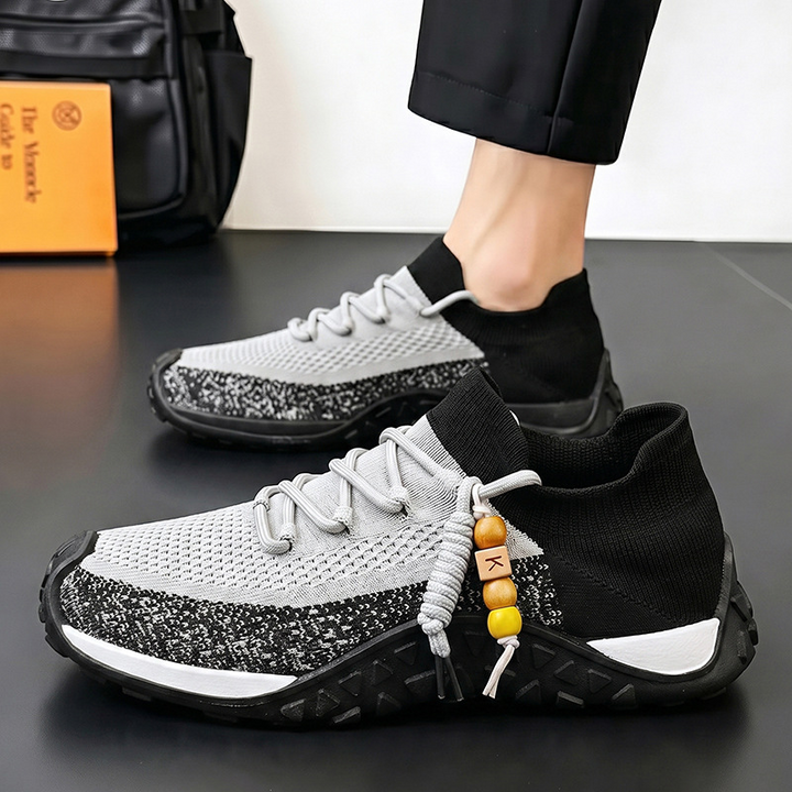 Side view of stylish gray men's walking shoes, lightweight and comfortable.