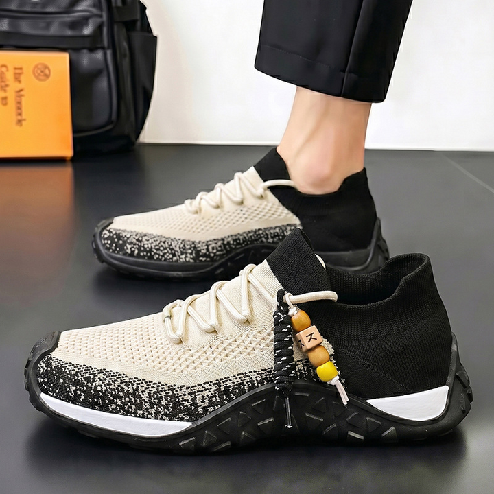 On-foot view of beige men's casual sneakers, showcasing everyday comfort.