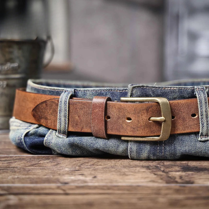 Close-up of the rich texture of a durable men's cowhide leather belt, perfect for any occasion.