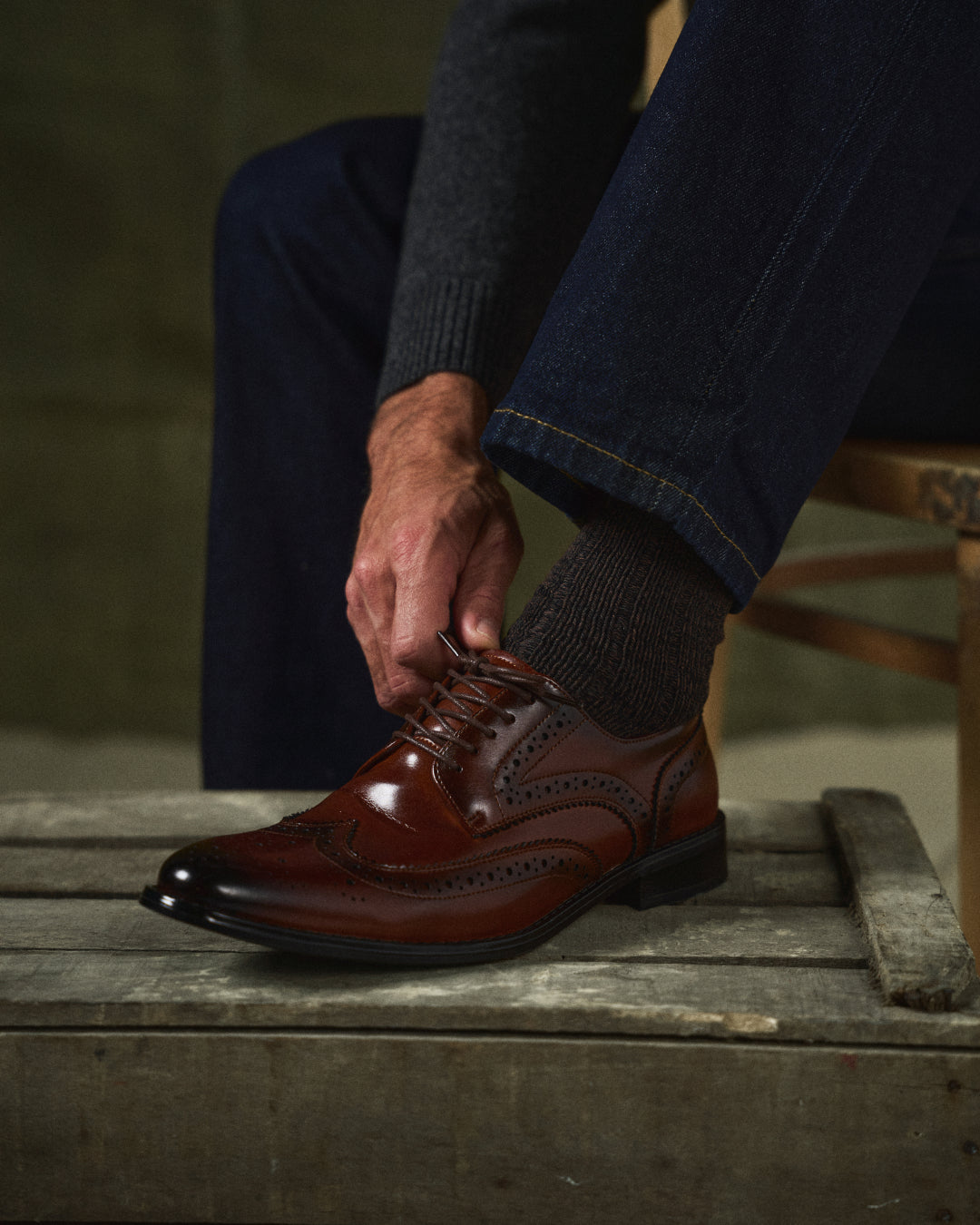 Side view of classic men's premium brown leather brogue Oxford shoes, versatile formal & casual footwear.