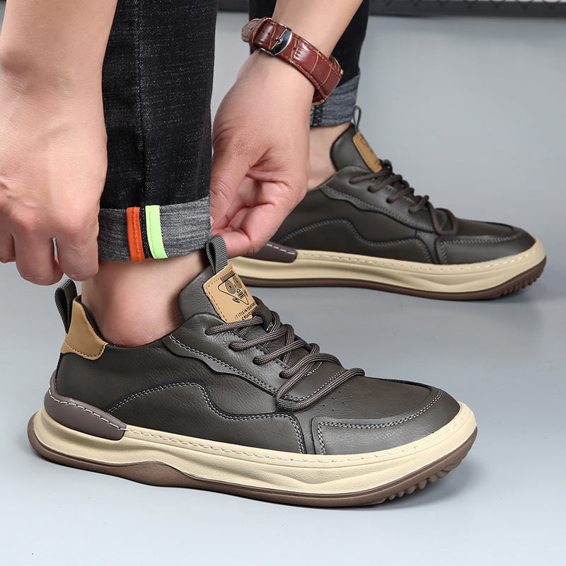 Gray men's fashion walking sneakers, comfortable footwear for modern men's everyday style.