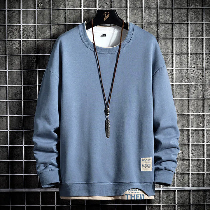 Men's premium dark grey comfort sweatshirt. Long sleeve, modern style for casual fall and winter wear.