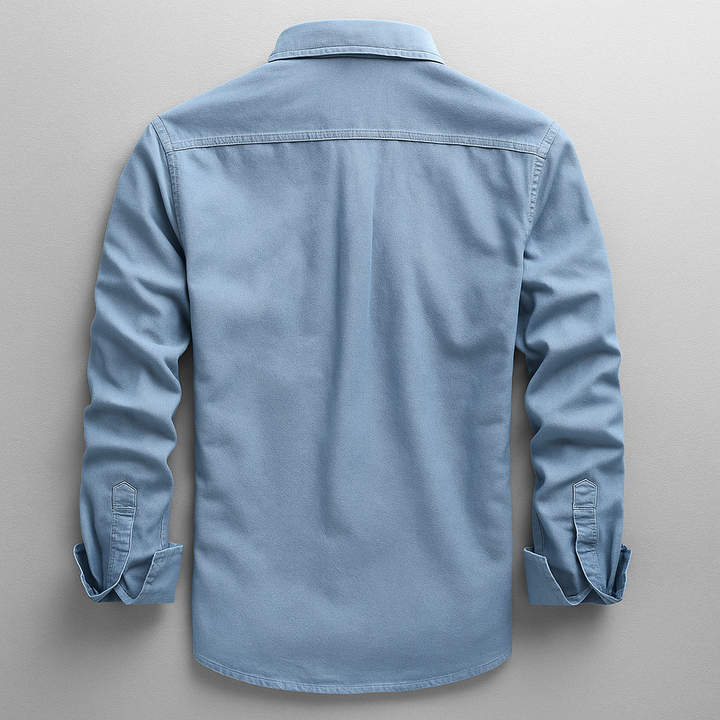 Close-up of a men's premium denim style button-up shirt, highlighting its texture and classic long sleeve design.