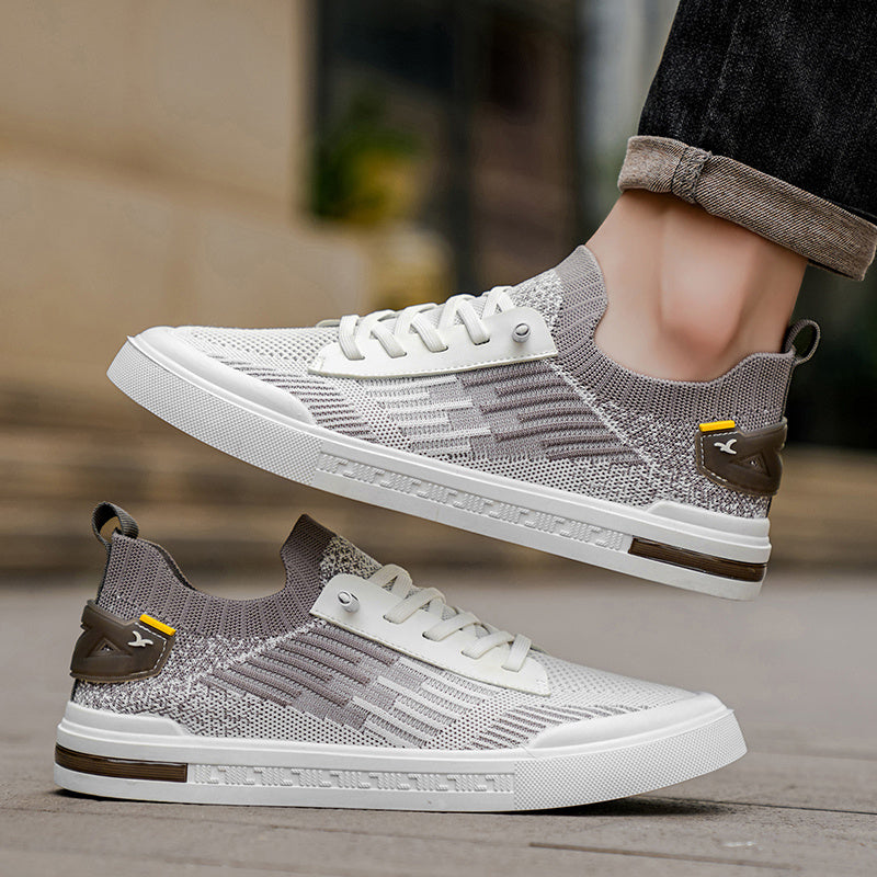 Lace-up men's lightweight casual sneakers, offering exceptional comfort for urban exploration.