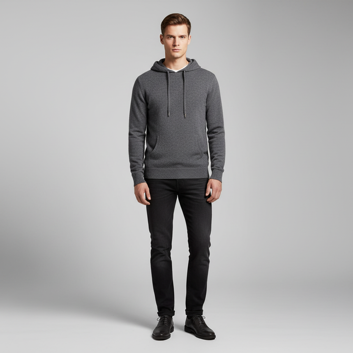 Lifestyle image of a comfortable men's wool sweater, the Merino Hoodie Finn, suitable for casual wear.