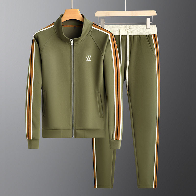 Man running in a men's sporty full-zip tracksuit set. Ideal athletic wear for jogging & outdoor activities.