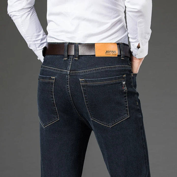 Stylish men's black stretch denim jeans, featuring a comfortable tailored fit, perfect for versatile men's fashion.