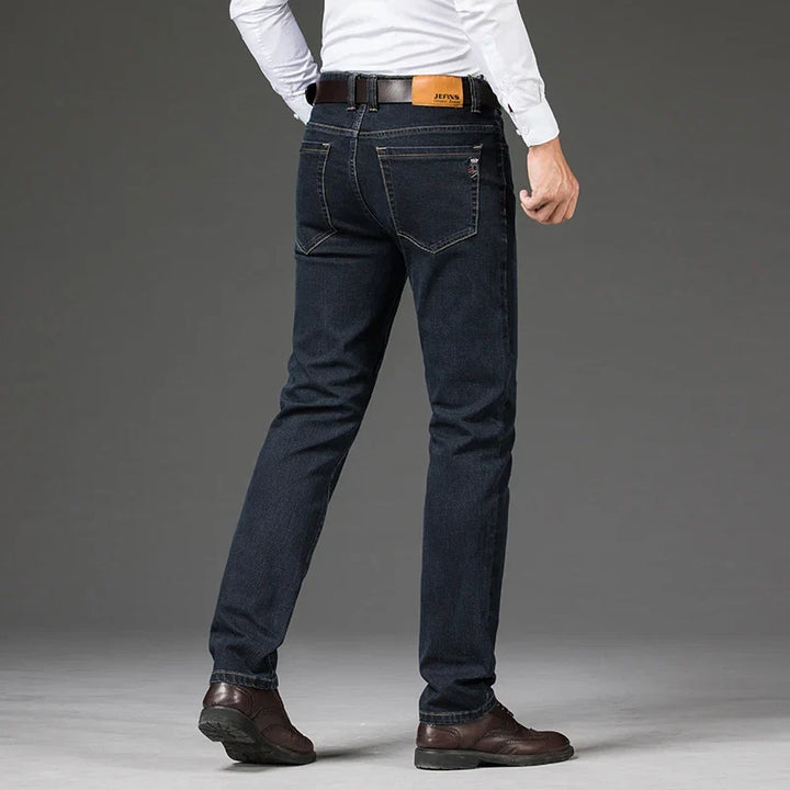 Close-up of comfortable men's stretch denim jeans fabric, highlighting flexibility & soft texture for daily comfort.