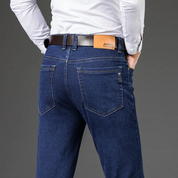 Men's tailored fit stretch denim jeans, showcasing modern style & a sleek silhouette for a sharp, fashionable look.