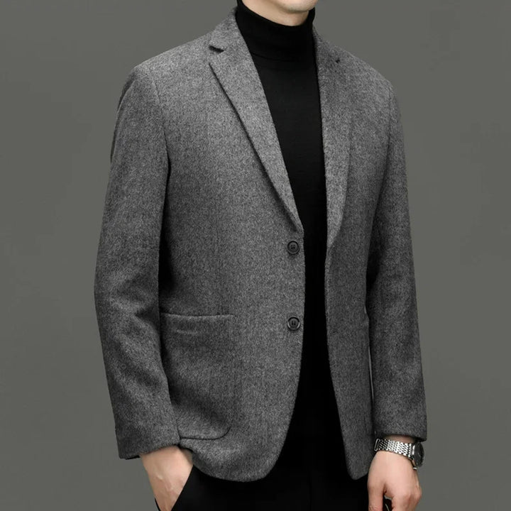 Back view of a perfectly fitted men's tailored blazer, highlighting the sharp cut and professional silhouette.