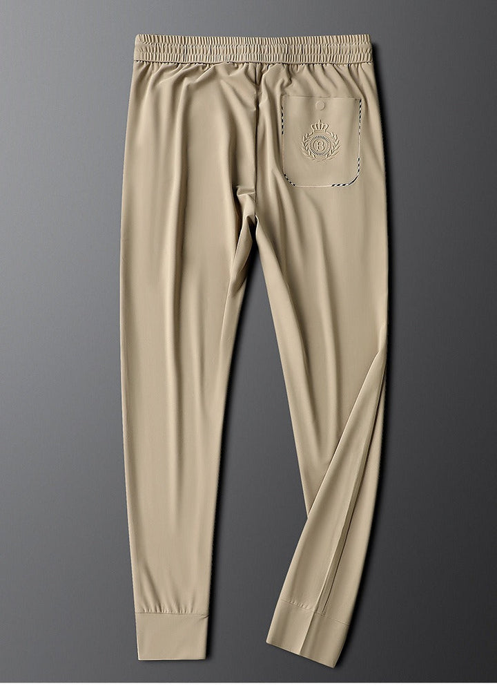 Stylish men's tailored dress trousers paired with a dress shirt, ideal for formal & business wear.