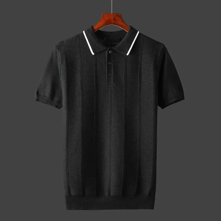 Detail of a men's premium knit polo shirt collar & buttons, showcasing its high-quality textured fabric & craftsmanship.