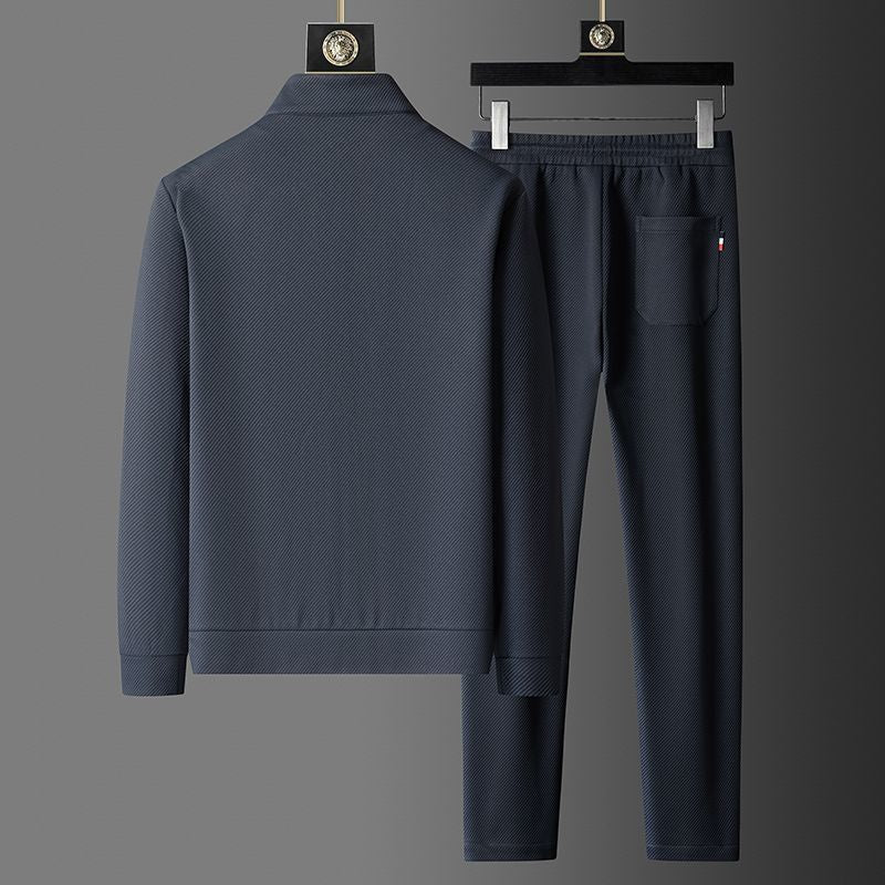 Stylish men's zip-up tracksuit jacket, part of a premium two-piece set for comfort & athletic wear.