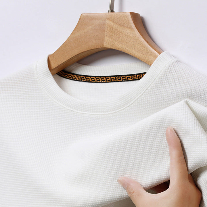 Men's versatile waffle knit t-shirt, a comfortable and stylish short sleeve textured tee for everyday use.