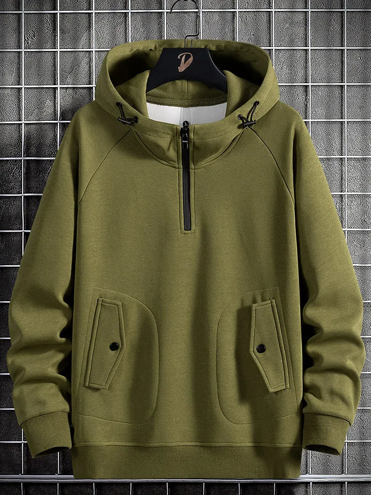 Casual men's quarter-zip hoodie, perfect for layering with flap pockets, relaxed & comfortable fit.
