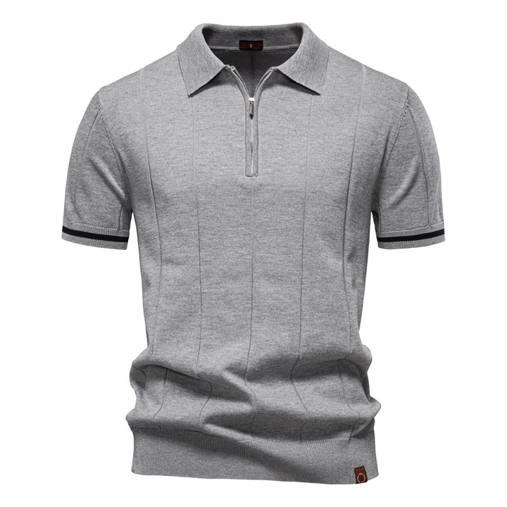 Comfortable men's quarter-zip polo shirt made from a premium cotton blend knit, great for daily wear.