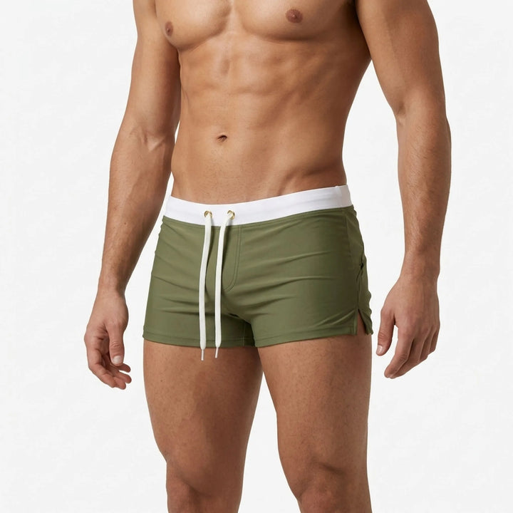 Fitted men's swimwear, quick-dry trunks with adjustable waist for comfort & performance.