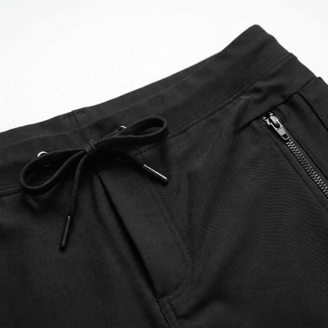 Stylish men's performance swim trunks. Quick-dry fabric, comfortable drawstring, and secure zipper pocket for active wear.