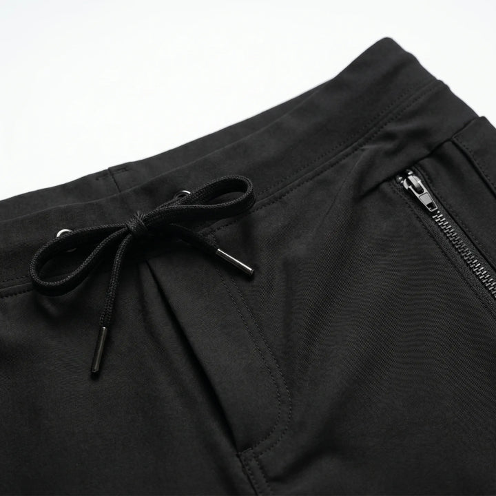 Stylish men's performance swim trunks. Quick-dry fabric, comfortable drawstring, and secure zipper pocket for active wear.