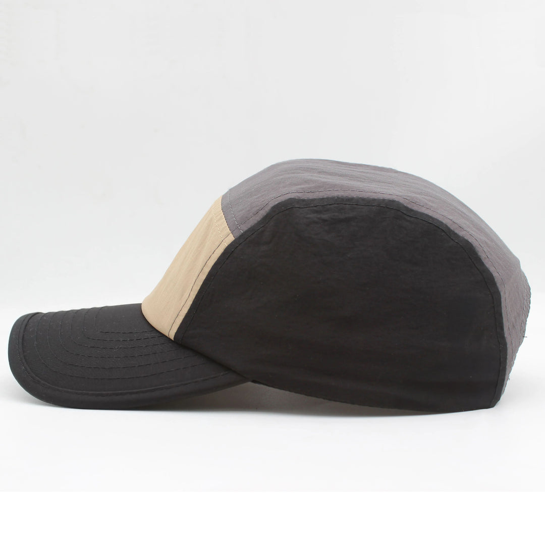 Close-up: Quick-dry fabric on men's running cap, highlighting UV protection & lightweight design.