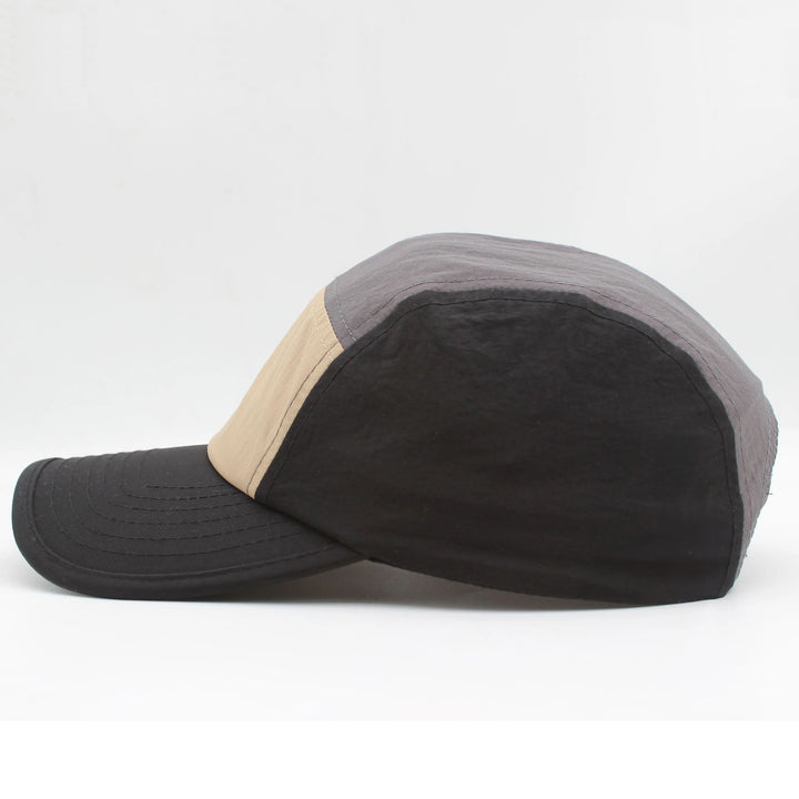 Close-up: Quick-dry fabric on men's running cap, highlighting UV protection & lightweight design.