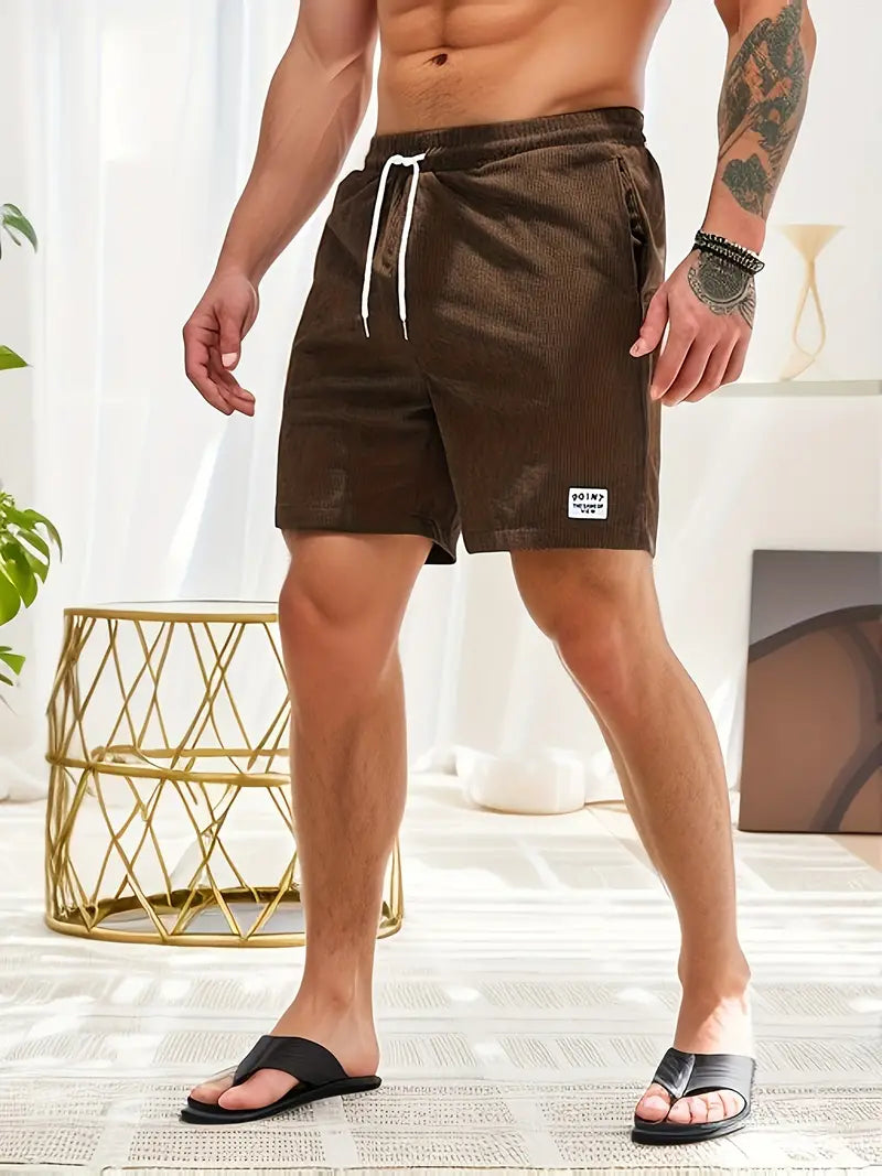Adjustable waist men's quick-dry swim trunks, great for swimming and summer fun.