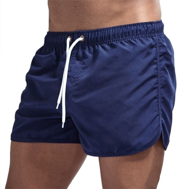 Close-up of the elastic comfort waistband on men's quick-dry swim shorts, perfect for beach and pool.