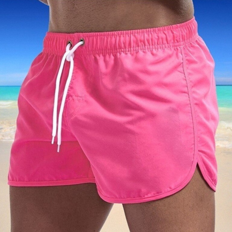 Stylish men's swimwear: blue quick-dry swim shorts with comfort waistband, essential for beach holidays.