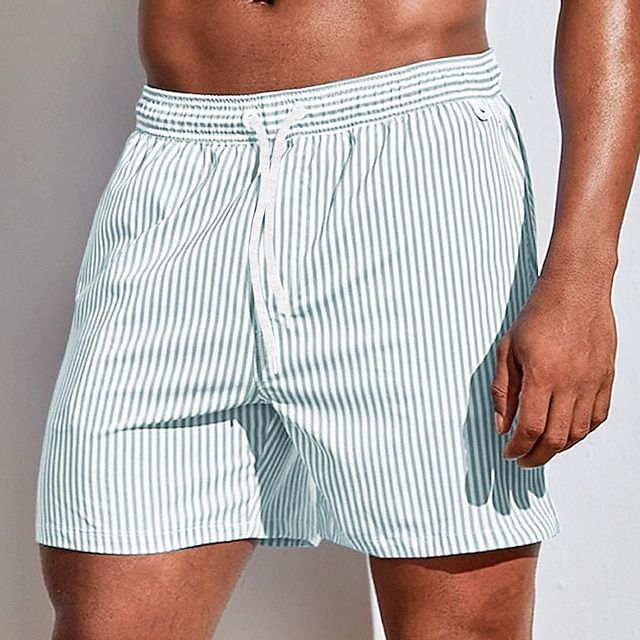 Striped men's quick-dry swim shorts, modern beachwear with drawstring, great for pool or vacation.