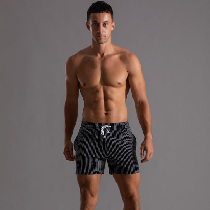 Men's sporty quick-dry swimwear, featuring comfortable built-in support and drawstring.