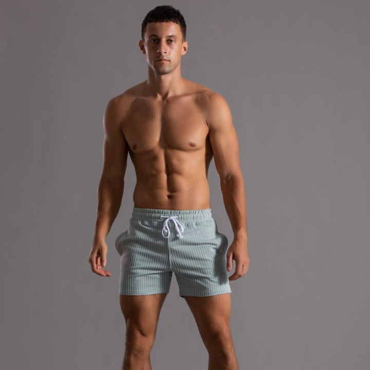 Elegant men's swim shorts, quick-dry fabric, stylish for pool parties or beach outings.