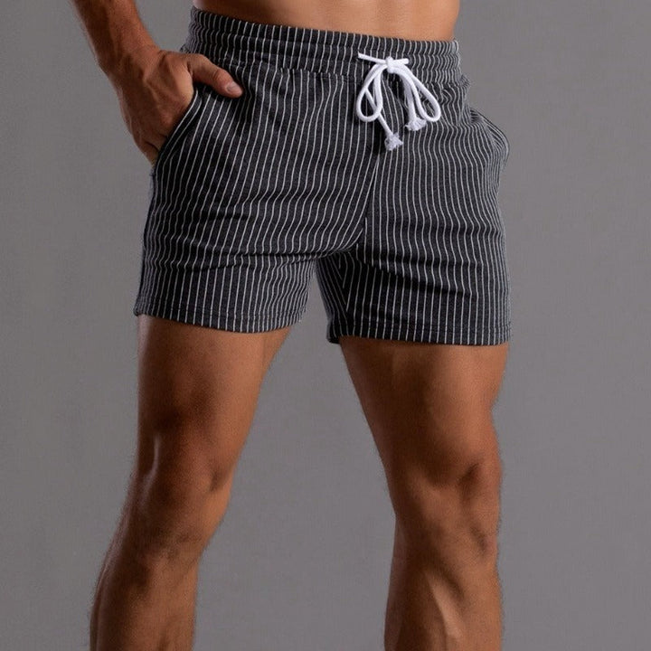 Lightweight men's quick-dry swim shorts, stylish design with comfortable inner brief.