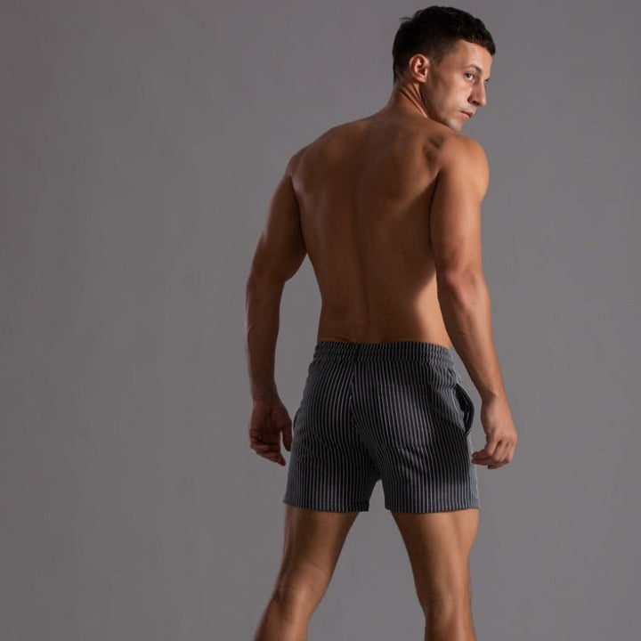 Fashionable men's quick-dry swim shorts with built-in brief, great for sports & leisure.