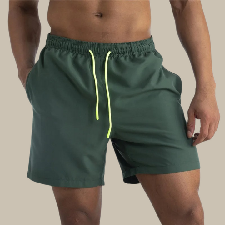 Men's quick-dry swim shorts with stretch fabric, perfect for beach, pool, or active summer vacation.
