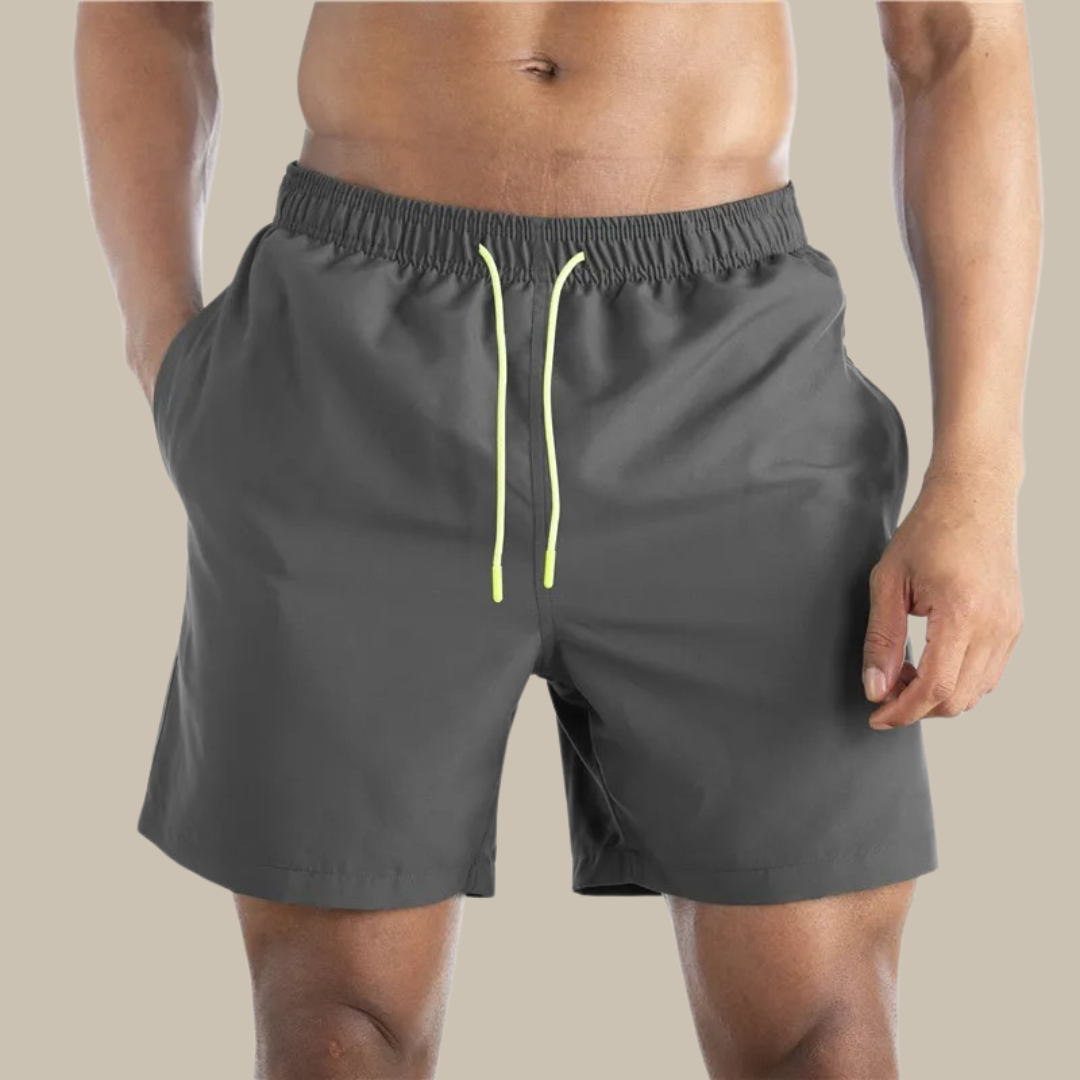 Mid-length men's quick-dry swimwear for comfort & style. Ideal beach shorts for summer vacation.