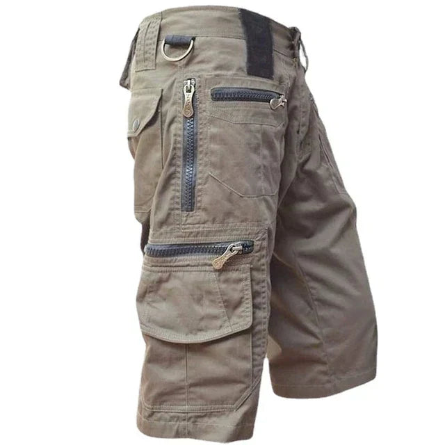 Active man wearing Men's TrailFlex quick-dry cargo shorts on a hiking trail, performance apparel.
