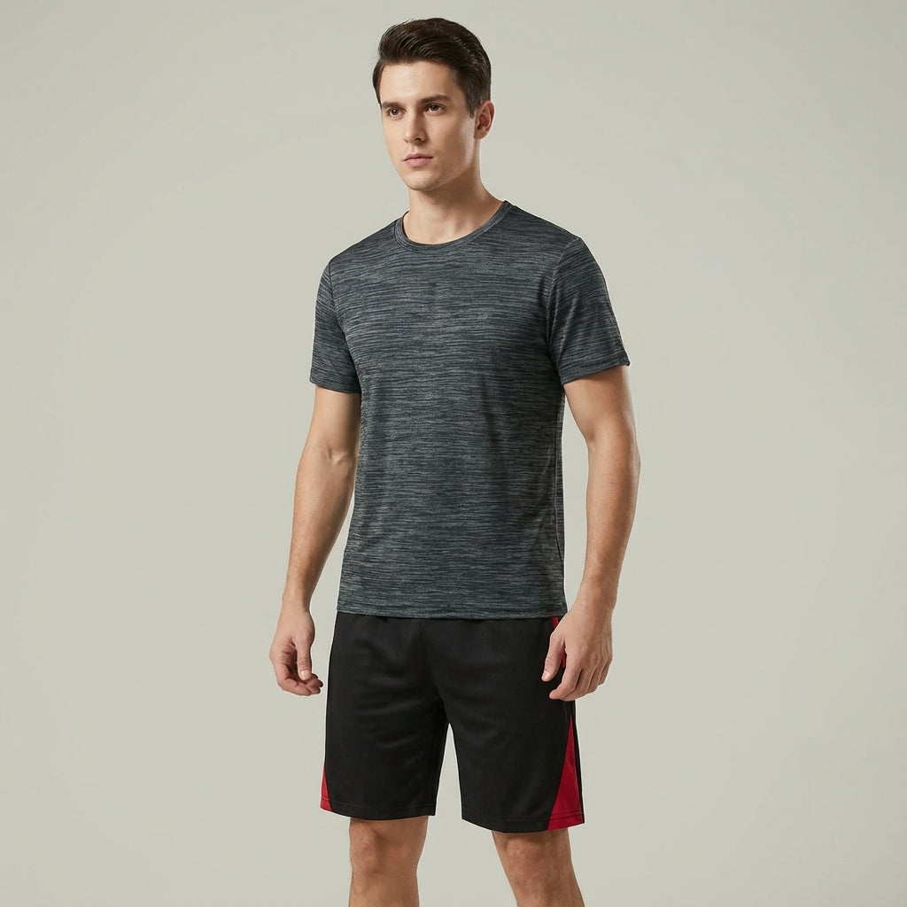 Model wearing 'Aaron' men's training set, actively engaging in a workout, sportswear